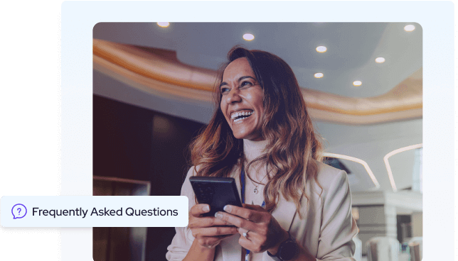 Professional woman smiling while using her phone